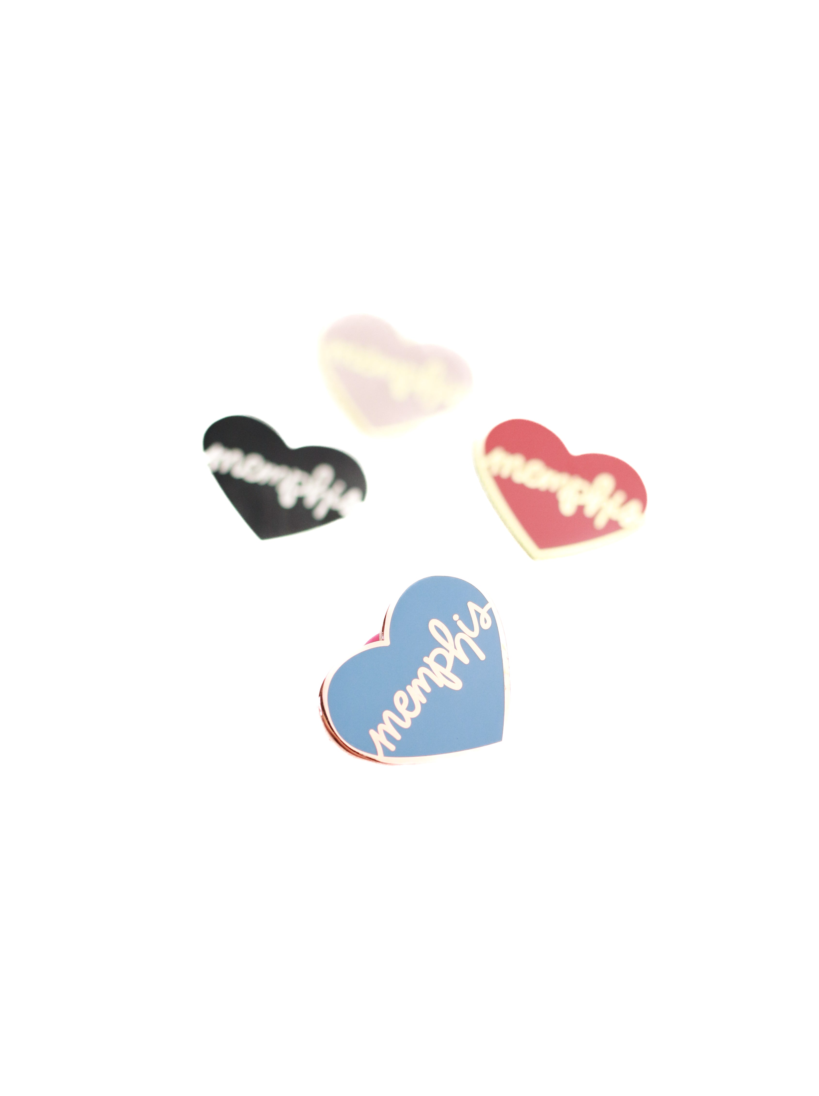 4 heart memphis enamel pins on white background blue heart in focus