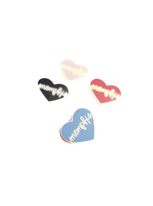 4 heart memphis enamel pins on white background blue heart in focus