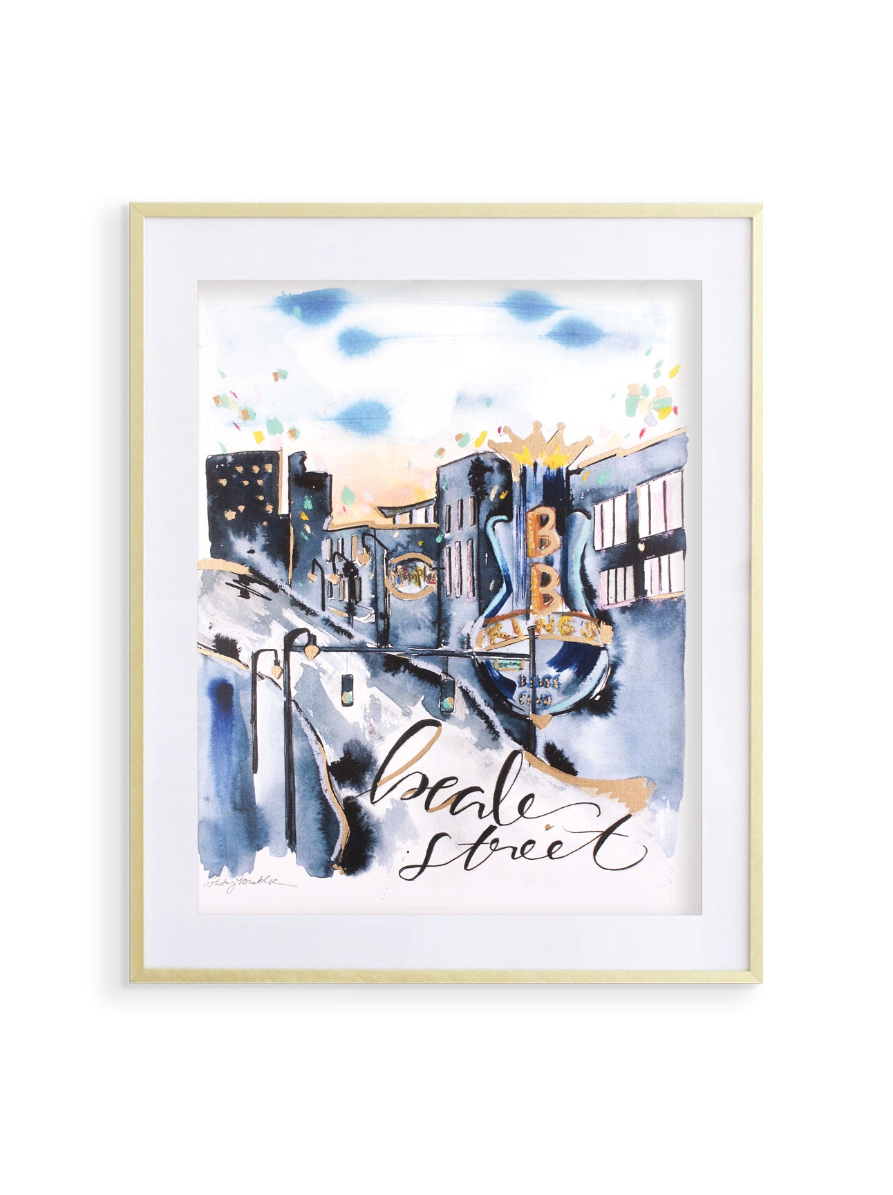 A framed print of Beale Street featuring a cityscape with metallic gold accents, predominantly in blue and white tones. With BB King sign in the foreground.