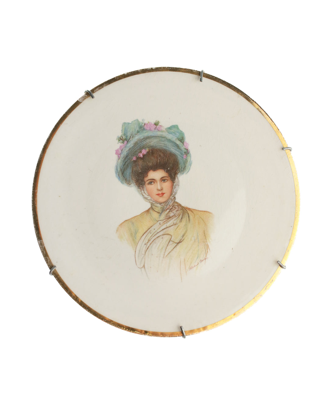 Decorative plate with a portrait of a woman in a pastel dress and hat on a white background