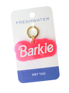 barbie pink dog tag with white lettering that says barkie on white background