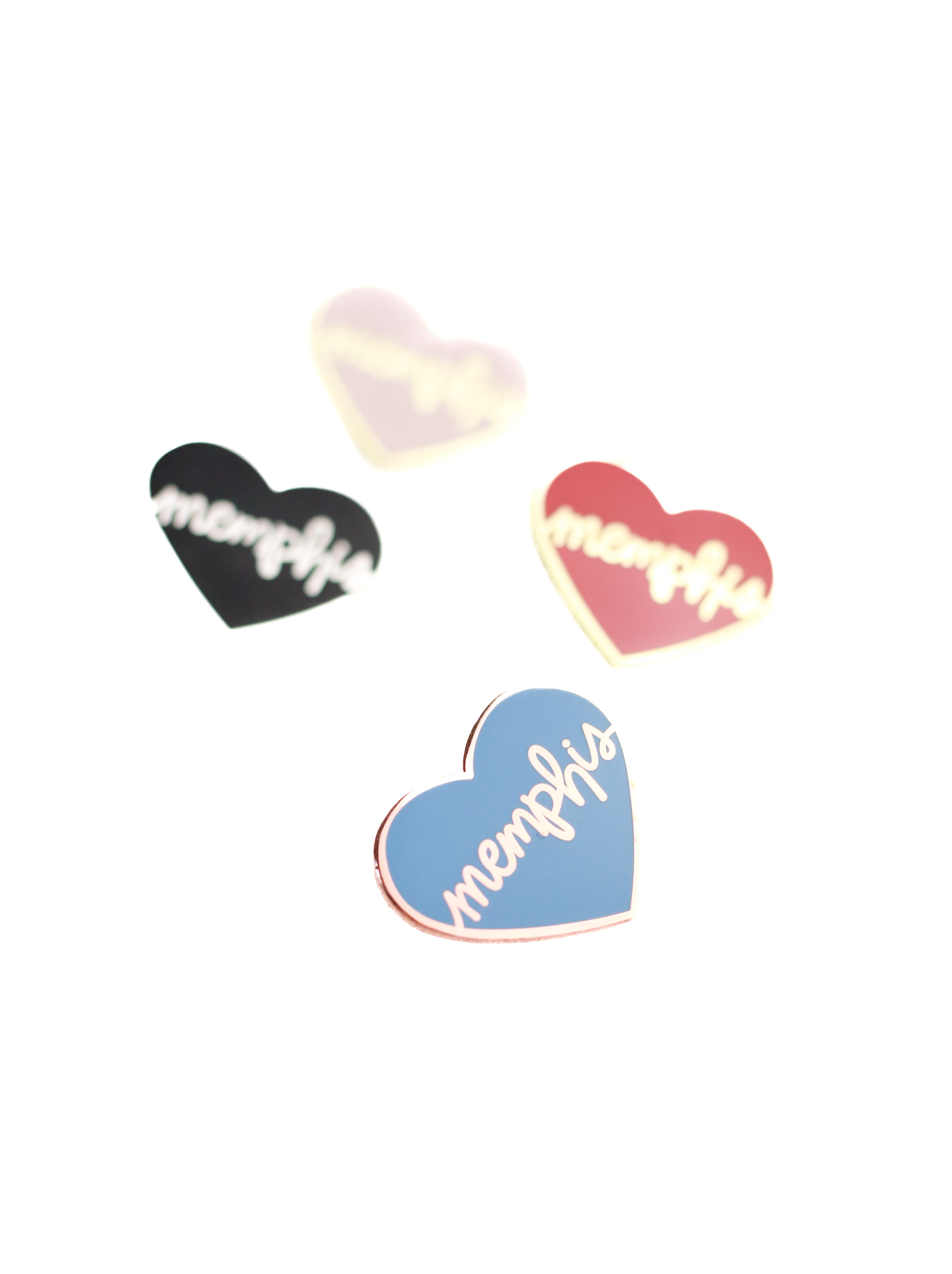 4 heart memphis enamel pins on white background