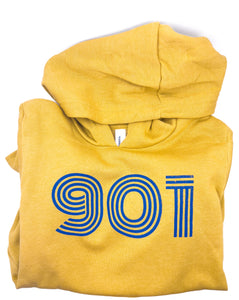 A mustard yellow hoodie with the text '901' and a blue stripe design folded