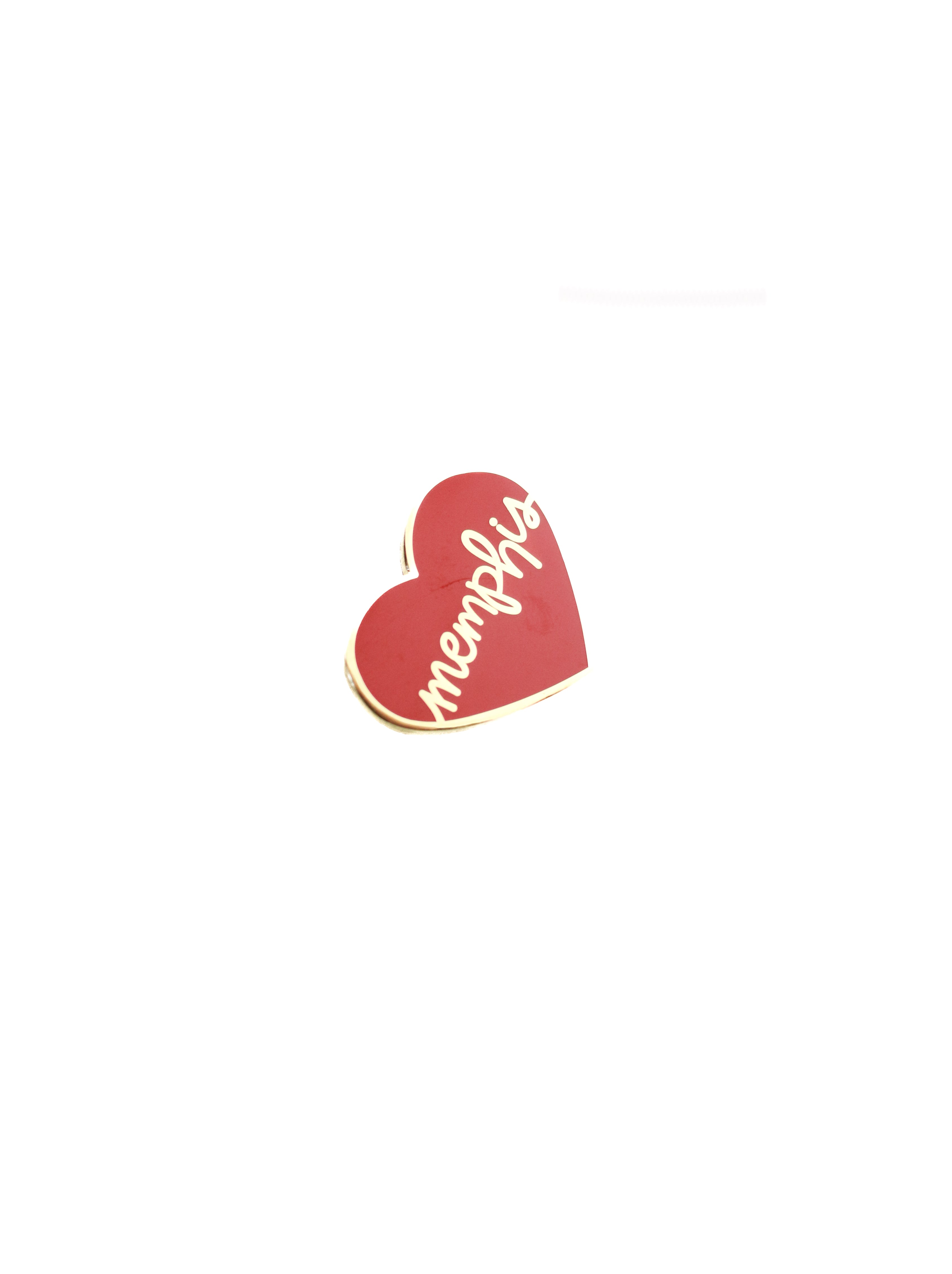 red enamel pin with gold lettering on white background