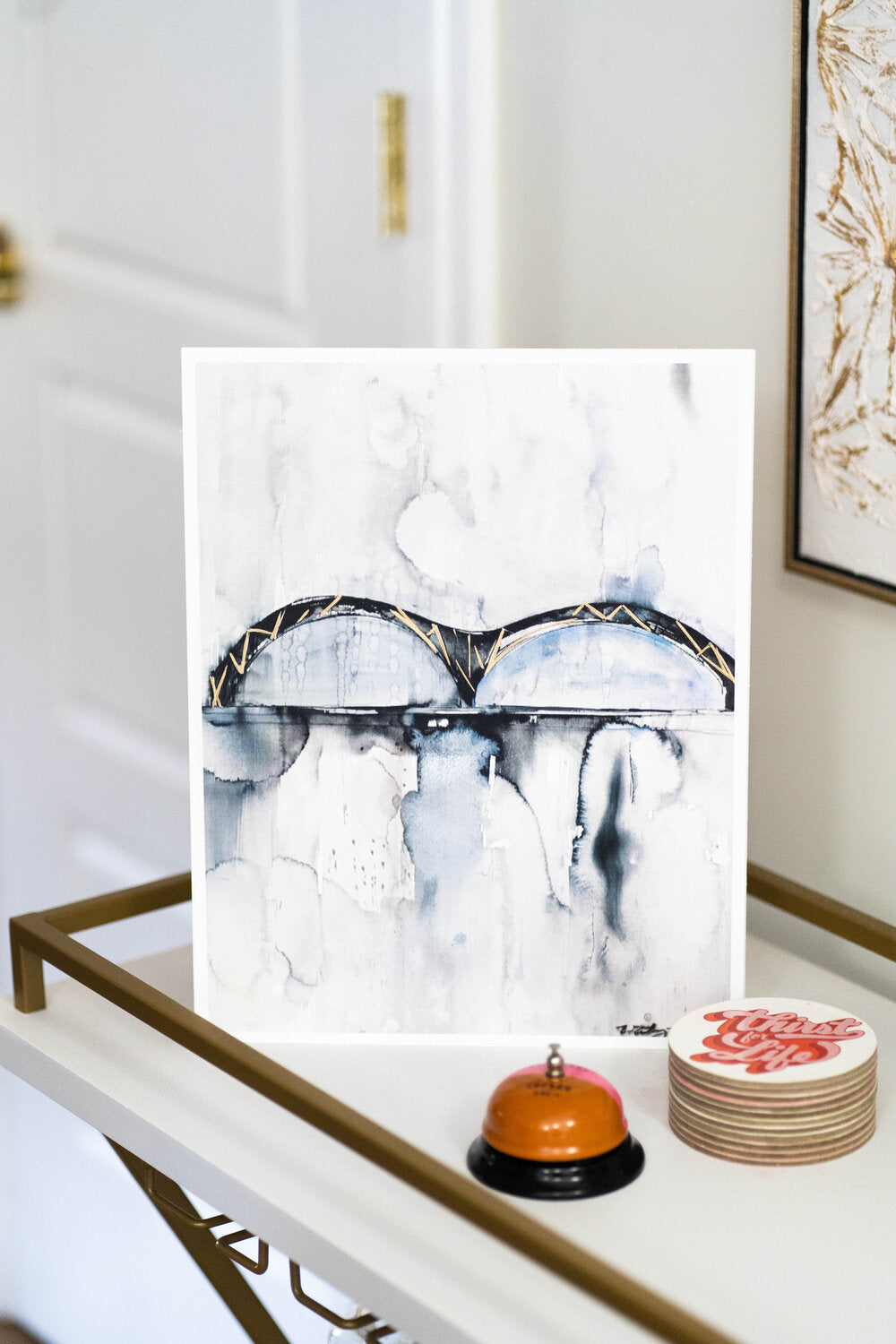 memphis bridge watercolor print styled in home on a bar cart 