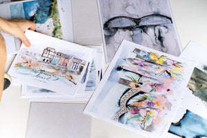 watercolor print pieces arranged on a white backrop